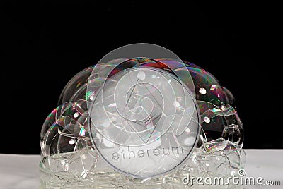 silver ether crypto currency behind many soap bubbles Editorial Stock Photo