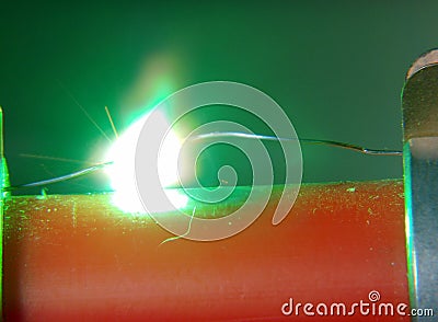 Silver fuse wire with 0,3mm diameter blows with a spark Stock Photo