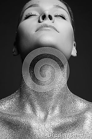 Silver Girl. Beautiful Young Woman with Sparkles on Body Stock Photo