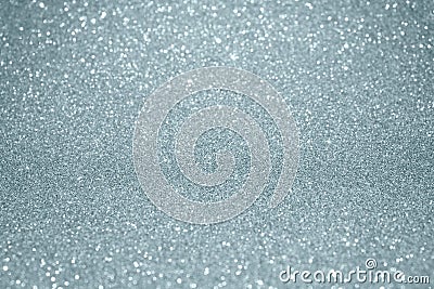 Silver glitter texture background with blur light effect and shiny sparkling particles. Glittering silver or shining snow light fo Stock Photo