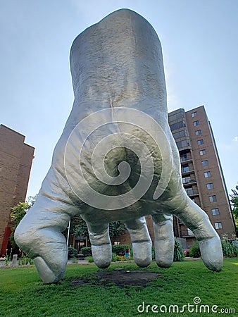 Silver hand sculpture in University Circle uptown district of Cleveland Editorial Stock Photo