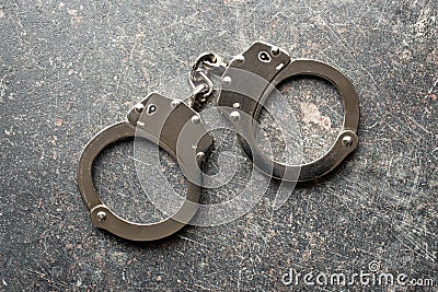 Silver handcuffs Stock Photo