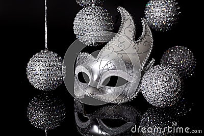 Silver Mask with Holiday Ornaments Stock Photo