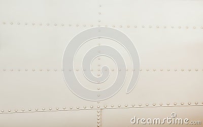 Silver metal surface of the aircraft fuselage with rivets Stock Photo