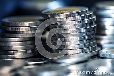 silver money coin stacking on dark background Stock Photo