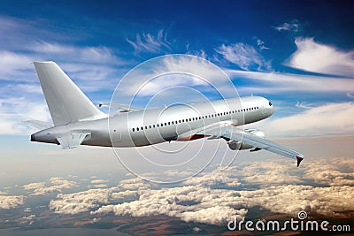 Silver passenger plane iflies high above the clouds. Back view of aircraft Stock Photo