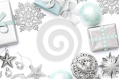 Silver and pastel blue christmas gifts, ornaments and decorations isolated on white background. Stock Photo
