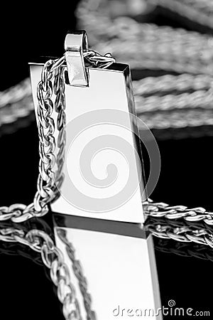 Silver pendant on a chain. Stock Photo