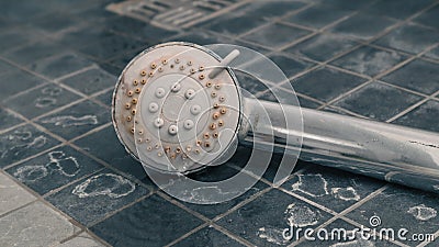 Silver shower head with limescales. Shower damaged from water scale Stock Photo