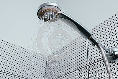 Silver shower head with limescales. Shower damaged from water scale Stock Photo