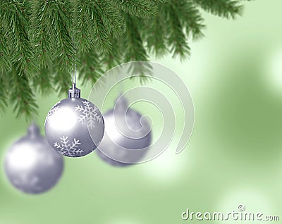 Silver snowflake christmas balls with abstract bokeh background and pine branches Stock Photo