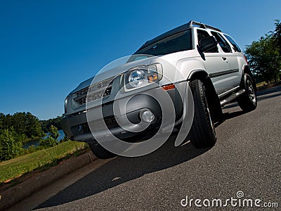 Silver Sports Utility Vehicle low angle Stock Photo