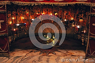 A silver star marks the traditional site of the birth of Jesus in Church of the Nativity, Bethlehem Editorial Stock Photo