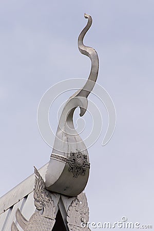 Silver Thai naga gable apex with sky, Lanna style Stock Photo