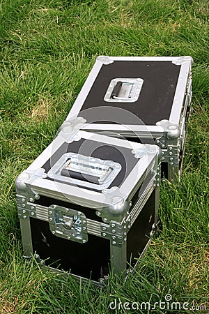 Silver tin box on a green lawn Stock Photo