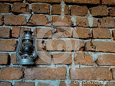 Silver vintage lantern on brick wall Stock Photo