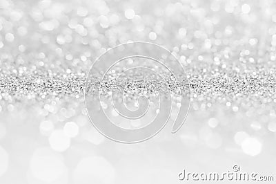 Silver white abstract light grey background, shining lights, sparkling glittering Christmas lights. Blurred abstract holiday backg Stock Photo