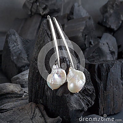 Silver white baroque pearl earrings Stock Photo