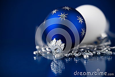 Silver, white and blue christmas ornaments on dark blue background. Merry christmas card. Stock Photo