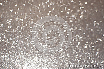 Silver white glittering Christmas lights. Blurred abstract background Stock Photo