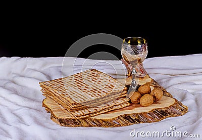 Silver wine cup with matzah, Jewish symbols for the Passover Pesach holiday. Passover concept Stock Photo