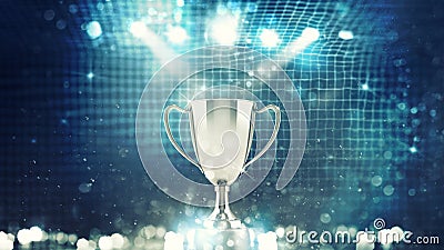 Silver winner s cup in the spotlight with soccer net background Stock Photo