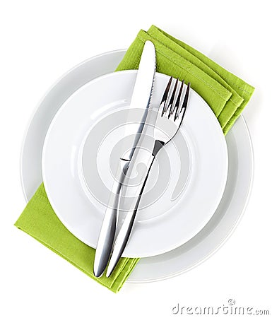 Silverware or flatware set of fork, spoons and knife on plates Stock Photo