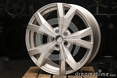 Silvery new cast aluminum wheels on a black background close up Stock Photo