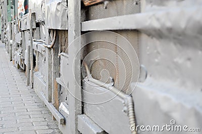 Silvery texture in steampunk style, cyberpunk bent, twisted, old metal sheets of tin, bolts, rivets, iron rods. The background Stock Photo