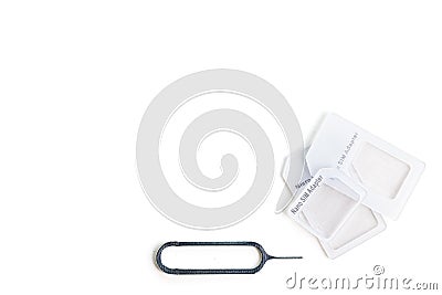 SIM card adapter with pin for mini, nano and micro sim card. Adapters on the sim card from larger to nano sim, isolate on a white Stock Photo