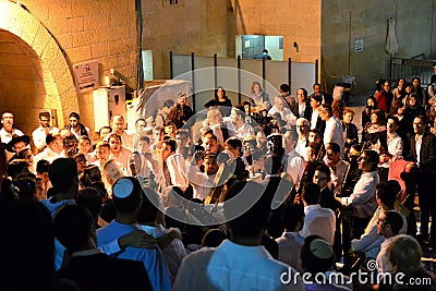 Jewish people celebrating Simchat Torah at western wall in the evening Editorial Stock Photo