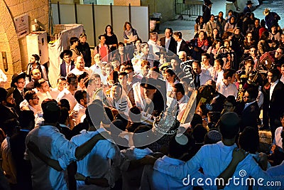 Jewish people celebrating Simchat Torah at western wall in the evening Editorial Stock Photo