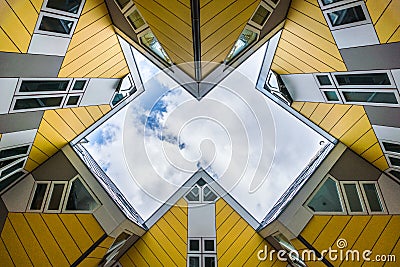 Simmetry Gleam between Yellow Cubic houses and apartments in Rotterdam. The Netherlands Editorial Stock Photo