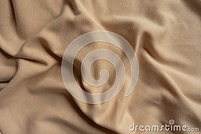 Simple beige jersey fabric in soft folds Stock Photo