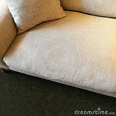 Simple beige sofa with cushion Stock Photo