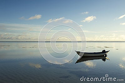 Simple Boat Floating in Calm Water Stock Photo