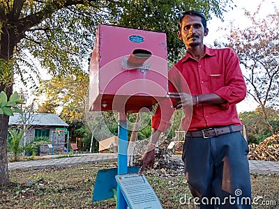 simple camera science model project displayed by Asian man at green park in India January 2020 Editorial Stock Photo