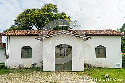 Simple catholic church at the main square in Coqueiros neighborhood Arembepe, Brazil Stock Photo