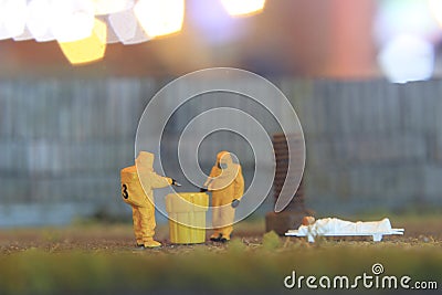 Simple Conceptual Photo, Mini Figure Doctor and Nurse Mini Figure Toy Evacuating corona virus suspect at empty land Stock Photo