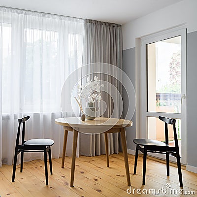 Simple dining area in bright room Stock Photo