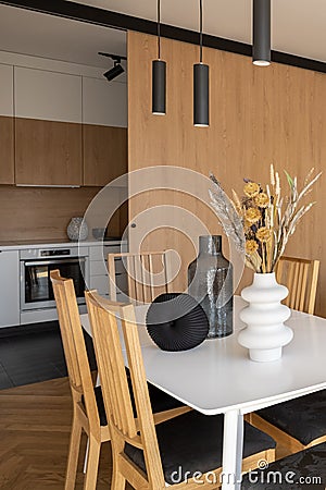 Simple dining table next to kitchen Stock Photo