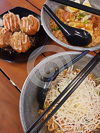 Simple dinner with ramen and takoyaki Stock Photo