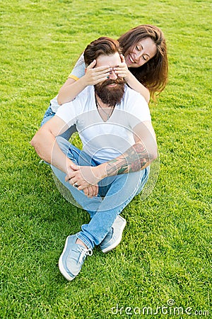 Simple happiness. Couple in love relaxing on green lawn. Playful girlfriend and boyfriend dating. Couple relations goals Stock Photo