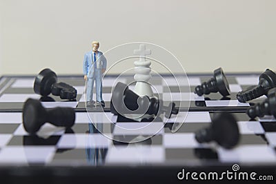 Illustration photo concept, 1 businessman mini figure toy help to winning war or Battle Small Magnetic Plastic Cartoon Illustration