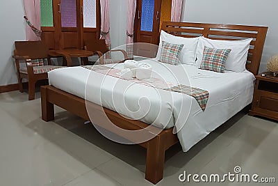 Simple interior bed room with wooden bad in a resort Stock Photo