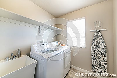 Simple laundry room interior with washing machines Stock Photo