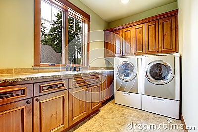 Simple laundry room with nice interior. Stock Photo