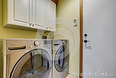 Simple laundry room with washer dryer set. Stock Photo