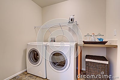 Simple laundry room with washer dryer set. Stock Photo