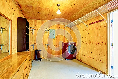 Simple laundry room with wooden trim in old farm house Stock Photo